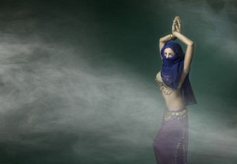 belly dancer in a cloud of fog
