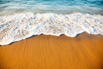 Wave on sandy beach