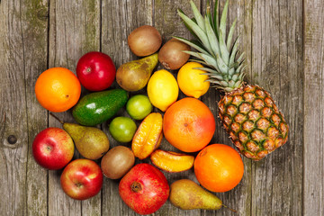 Set of colorful fruits on old wood background