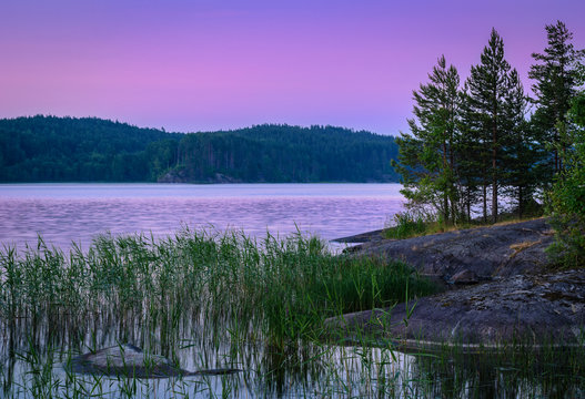 violet sunset over lake © sinelyov