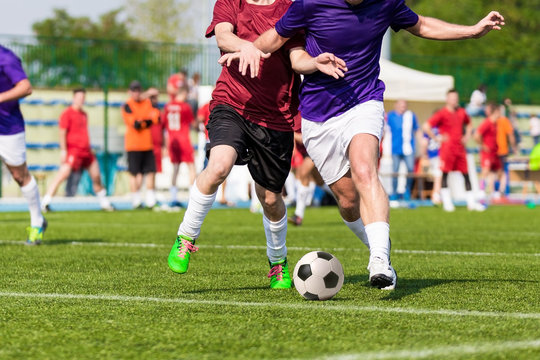 football soccer game. competition between two running players