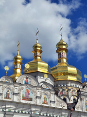 Fototapeta na wymiar dome of the church, clouds and trees in Kiev