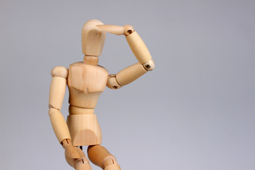 Wooden mannequin looking