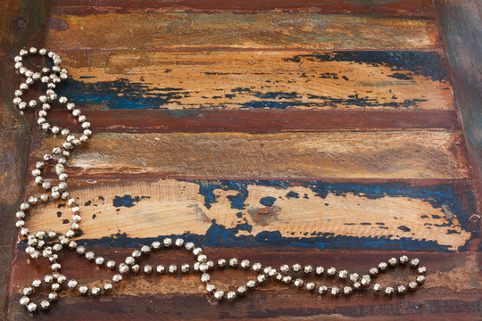 Background wooden table with christmas chaplet