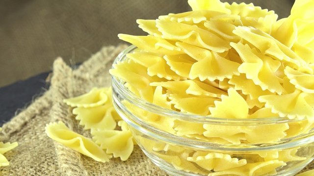 Uncooked Bow-Tie Pasta (not loopable 4K UHD footage)