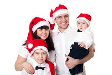 Happy cute family in santa's hats