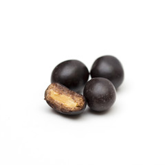 peanuts in chocolate on the white background
