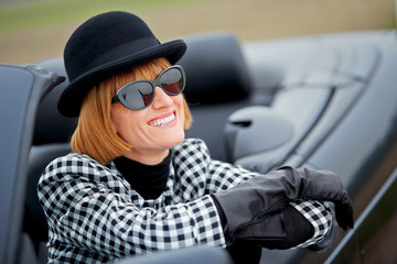 40s woman happy with new Convertible