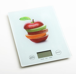 Fruits on digital weight scale