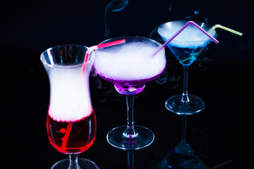 photo of a colored drink with smoke