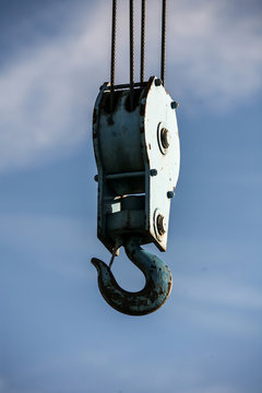 Crane hook on a blue sky