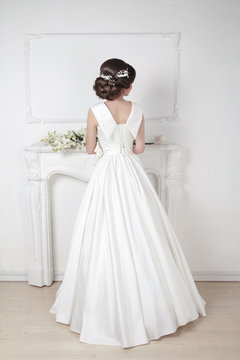 Bridal hairstyle. Beautiful charming bride in wedding luxurious