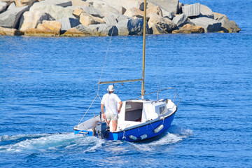 old man sailing in Sardinia