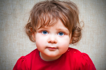 Fototapeta premium Adorable little girl with big blue eyes