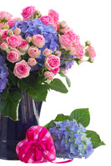 pink roses and blue hortensia flowers close up