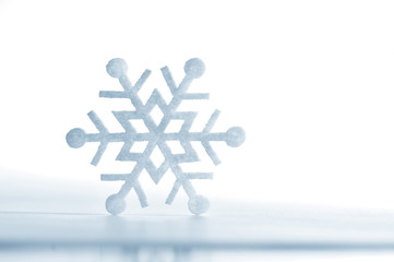 snowflake made of felt isolated on a white background