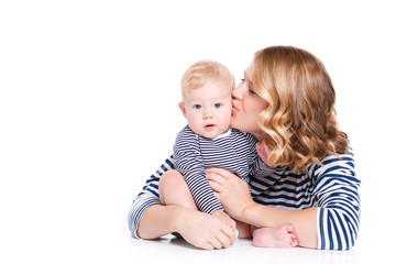 Young mother playing with her little son.