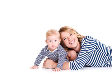 Young mother playing with her little son.