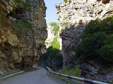 Winding asphalt road in a mountain gorge