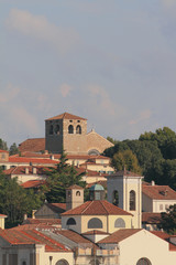 Fototapeta premium Belltowers and roofs of houses. Trieste, Italy
