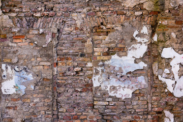 Old brick wall of an abandoned building