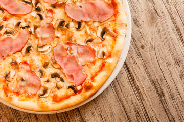 pizza on wooden background