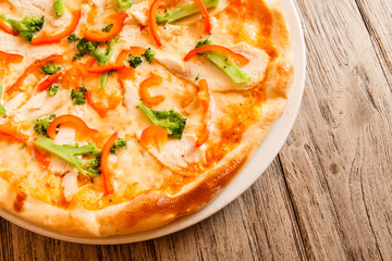 pizza on wooden background