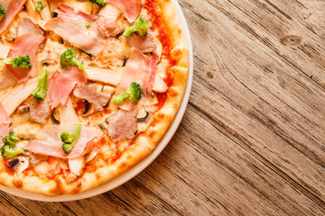 pizza on wooden background