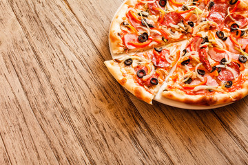 pizza on wooden background