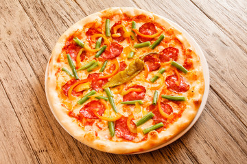 pizza on wooden background