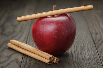 red ripe apple and cinnamon