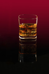Glass with whiskey and ice
