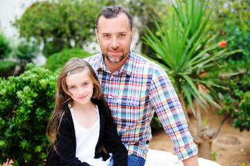 Fototapeta premium Father and daughter together outside in summer day