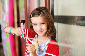 Cute little girl with her doll