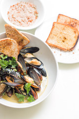 Cooked mussels in a with bowl