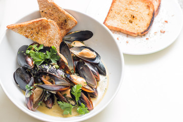 Cooked mussels in a with bowl
