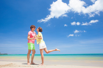 couple walking at tropical beach