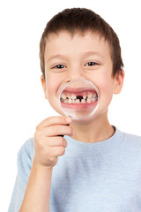 boy show lost tooth through magnifying glass