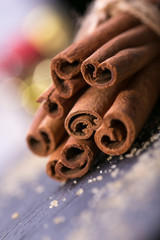 Star anise with cinnamon sticks over black stones background 