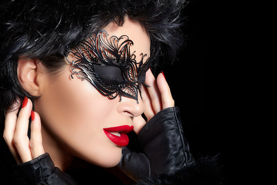 Masquerade. High Fashion Portrait of Beautiful Woman with Black