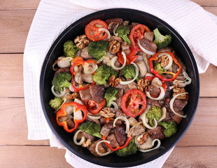 Braised wild mushrooms with vegetables and spices in pan