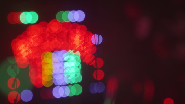 Christmas holidays lights blinking out of focus background