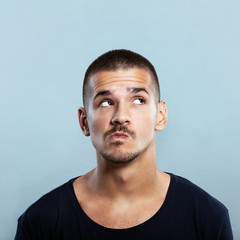 Fototapeta premium Studio shot of a handsome young man thinking