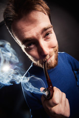 Funny man smoking pipe. Wide angle shoot.