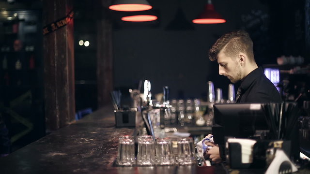 The robber breaks into a bar and takes the money
