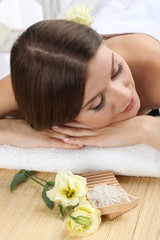 Plakat Beautiful young woman having relax in spa salon