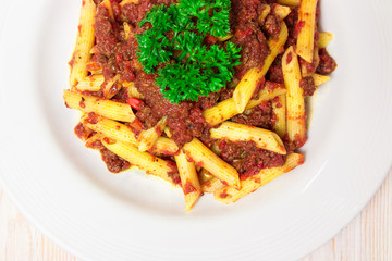 Penne pasta with a tomato bolognese beef sauce