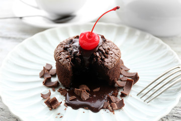 Hot chocolate pudding with fondant centre on plate, close-up