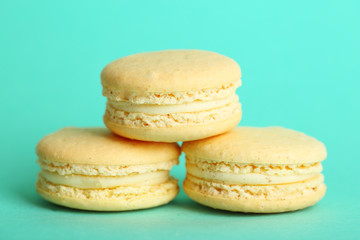 Gentle colorful macaroons on color background