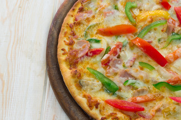 Delicious pizza, pepper with bacon on wood